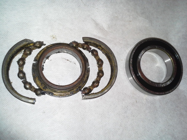 A DIY exploded view of the old center support bearing with the new one on the right.