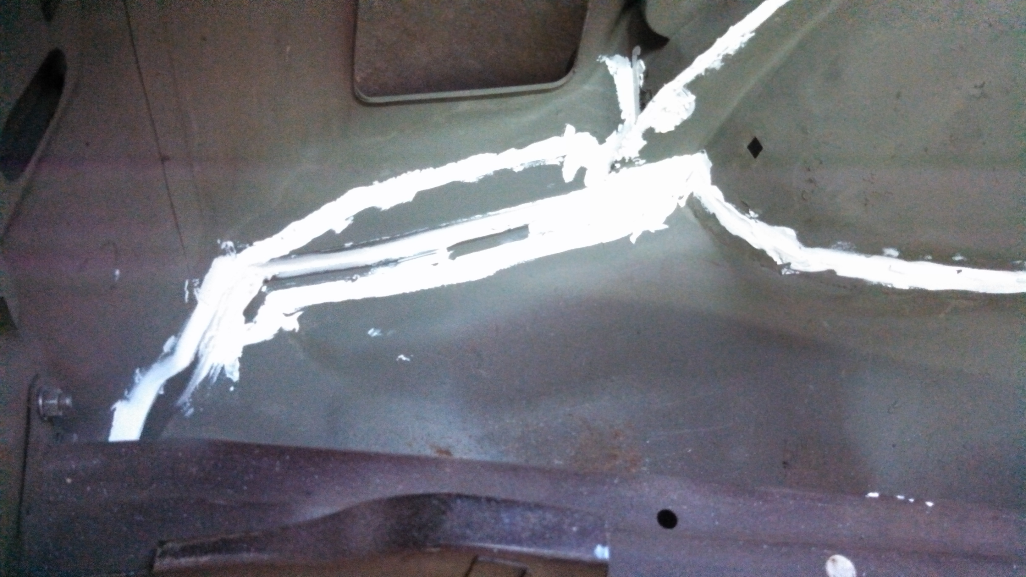 rear corner rust repair welded and sealed.jpg