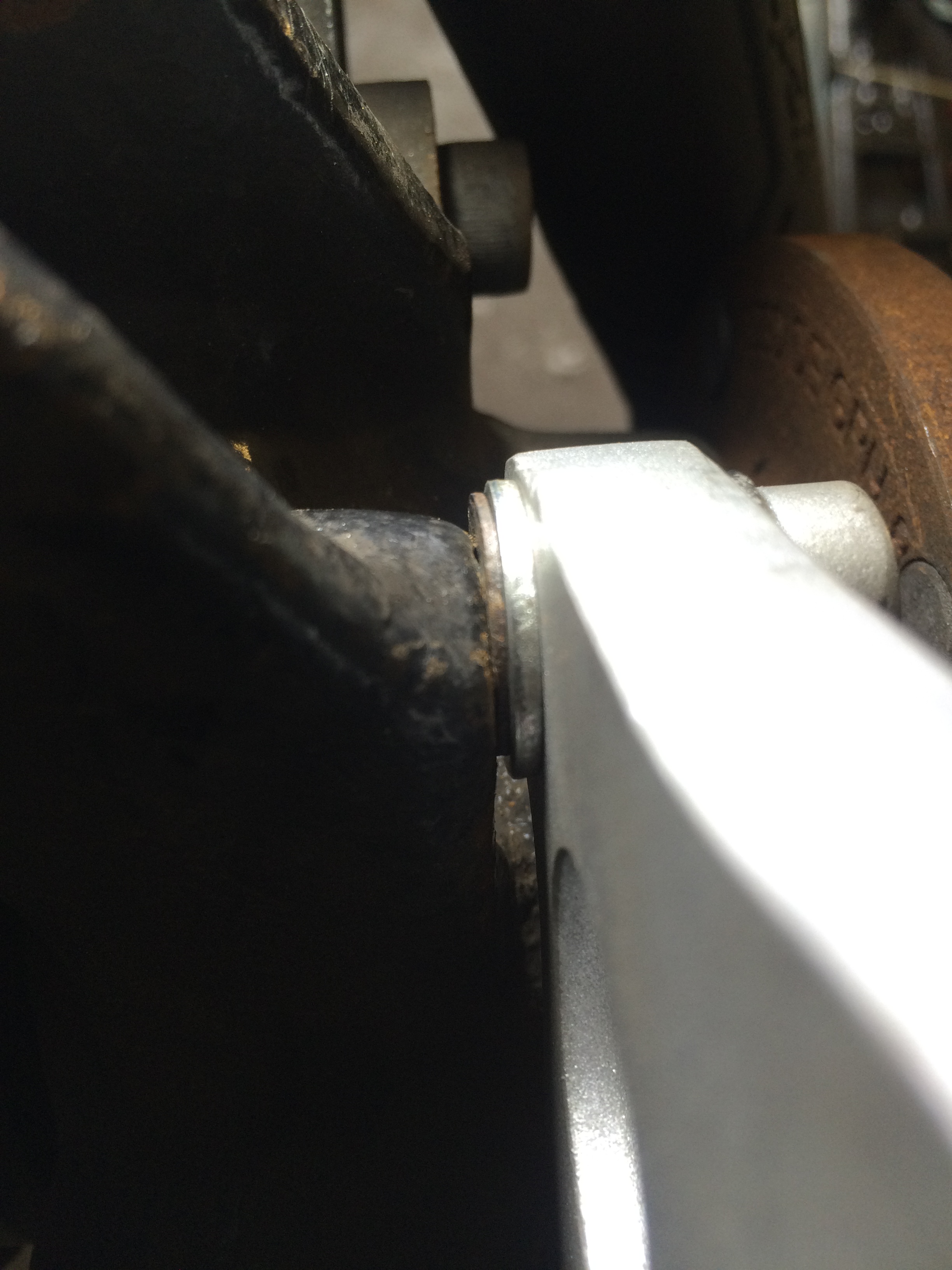 Spacers installed to keep bracket in the same plane as the rotor. Only needed on upper mounting point.