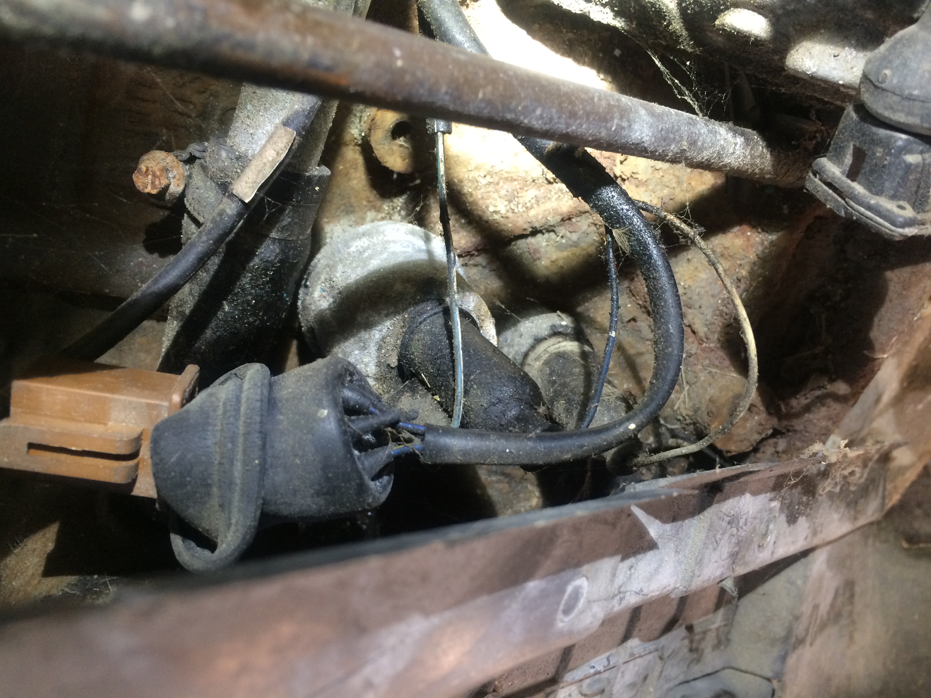 On a 7a Coupe the oil pressure switch is mounted there.