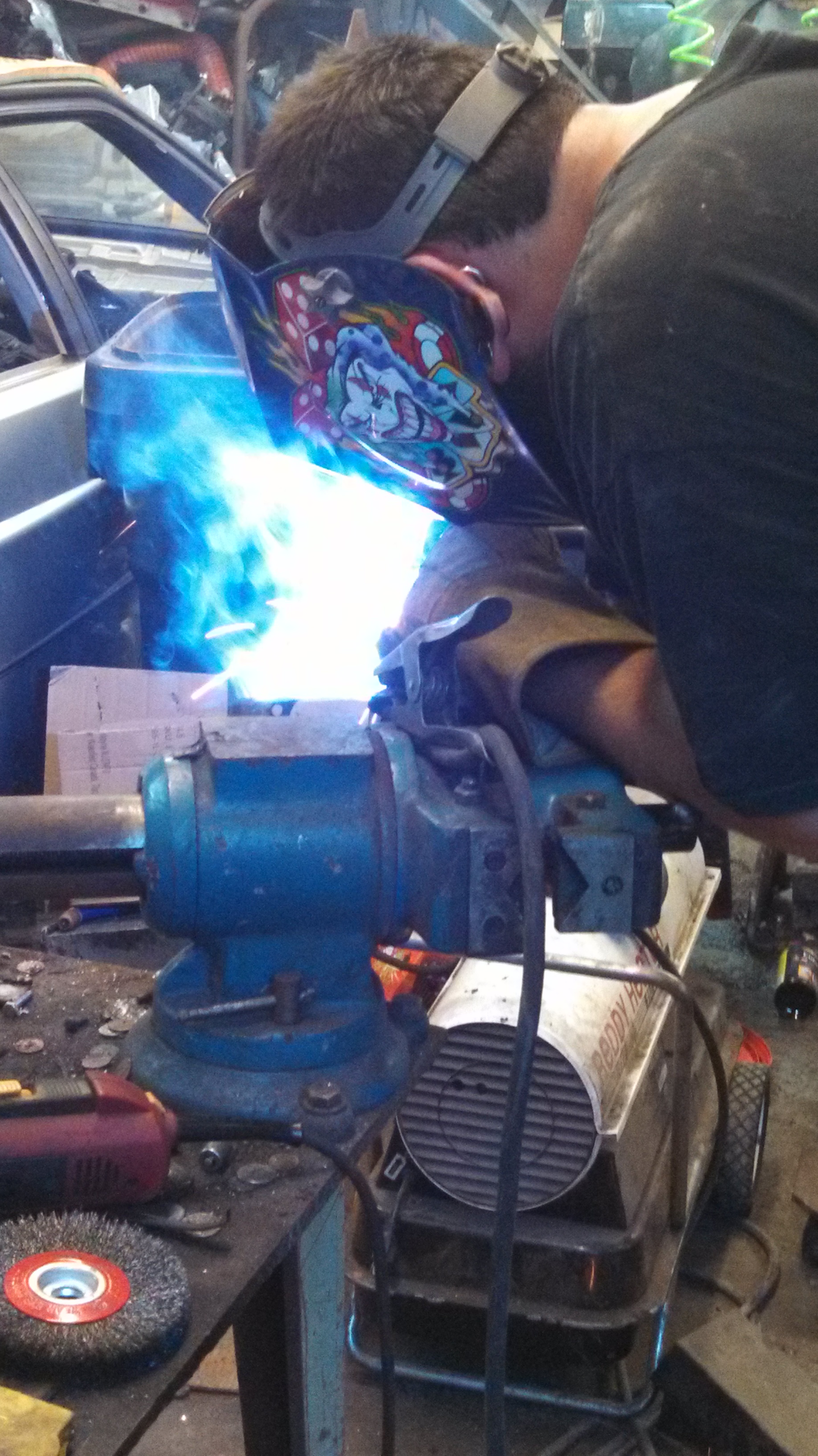 Jim welding strut top tubes.jpg